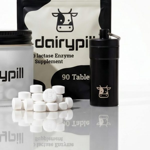 DairyPill Key Pod keychain case next to DairyPill tablets
