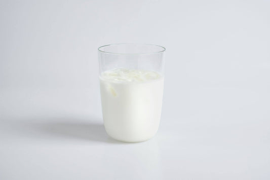A glass of milk on a white background