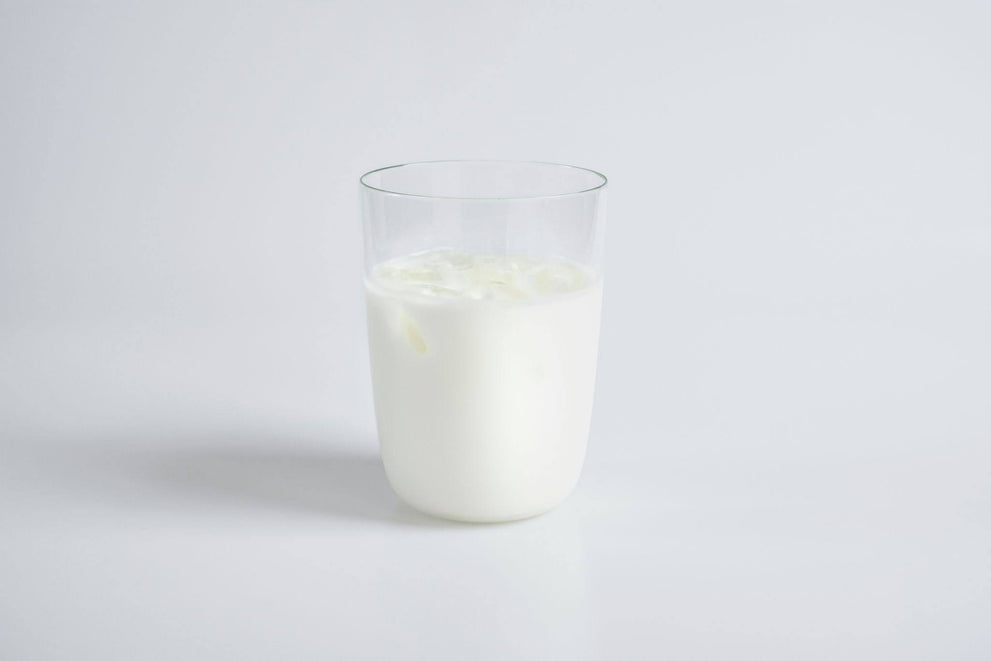 A glass of milk on a white background